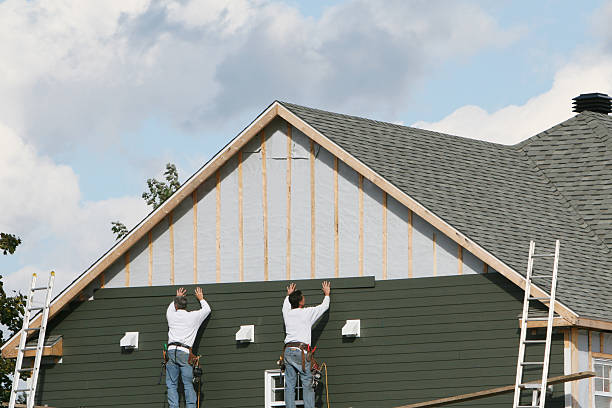 Professional Emergency Siding Repair technician working in Louviers, CO